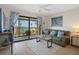 Comfortable living room with water views and sliding glass doors at 8141 Aquila St # 347, Port Richey, FL 34668
