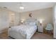 Spacious bedroom with ensuite bathroom access and a ceiling fan at 8141 Aquila St # 347, Port Richey, FL 34668