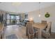Light and airy dining area with a table and chairs, near living room at 8141 Aquila St # 347, Port Richey, FL 34668