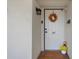 Inviting condo entry with a wreath and potted plants at 8141 Aquila St # 347, Port Richey, FL 34668