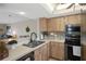 Kitchen with stainless steel appliances and wood cabinets at 8141 Aquila St # 347, Port Richey, FL 34668