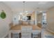 Bright dining area with light wood table and wicker chairs at 8141 Aquila St # 347, Port Richey, FL 34668
