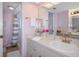 Bathroom with pink walls, a single sink vanity, and a shower/tub combo at 8141 Aquila St # 347, Port Richey, FL 34668