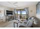 Living room with water views and sliding doors to balcony at 8141 Aquila St # 347, Port Richey, FL 34668