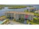 Aerial view of a waterfront condo building with a pool and boat slips at 8141 Aquila St # 347, Port Richey, FL 34668