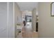 Condo entryway with light hardwood floors, leading to living area at 8141 Aquila St # 347, Port Richey, FL 34668