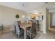 Bright dining area with light wood table and wicker chairs at 8141 Aquila St # 347, Port Richey, FL 34668