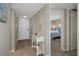 Bright condo entryway with hardwood floors and view of bedroom at 8141 Aquila St # 347, Port Richey, FL 34668