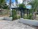 Large backyard with a wooden pergola and a patio area at 10448 Canary Ave, Weeki Wachee, FL 34613