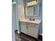 Bathroom with updated vanity and modern lighting at 10448 Canary Ave, Weeki Wachee, FL 34613
