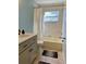 Updated bathroom with new vanity and bathtub at 10448 Canary Ave, Weeki Wachee, FL 34613