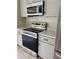 Stainless steel range and microwave in the kitchen at 10448 Canary Ave, Weeki Wachee, FL 34613