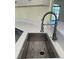 Stainless steel sink with a modern gooseneck faucet at 10448 Canary Ave, Weeki Wachee, FL 34613