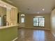 Kitchen with a breakfast bar and view into living area at 10448 Canary Ave, Weeki Wachee, FL 34613