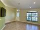Living room with tile floors and lots of natural light at 10448 Canary Ave, Weeki Wachee, FL 34613