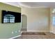Living room with a wall-mounted TV and tile floors at 10448 Canary Ave, Weeki Wachee, FL 34613