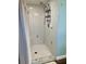 Clean shower with tiled walls and built-in shelving at 10448 Canary Ave, Weeki Wachee, FL 34613