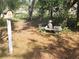Landscaped yard with a bench and birdhouse at 12266 Birch St, Brooksville, FL 34613