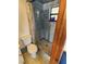 Classic bathroom with a blue-tiled shower, creating a clean and functional space at 12266 Birch St, Brooksville, FL 34613