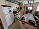 Compact kitchen with essential appliances, ample counter space, and practical storage solutions at 12266 Birch St, Brooksville, FL 34613