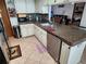 Well-equipped kitchen with granite countertops and stainless steel appliances at 12266 Birch St, Brooksville, FL 34613