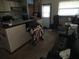 Functional living space with kitchen area, ideal for a combined living, dining, and working area at 12266 Birch St, Brooksville, FL 34613