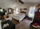 Comfortable main bedroom with a vaulted ceiling, large bed, and plenty of natural light at 12266 Birch St, Brooksville, FL 34613
