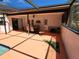 Covered patio for outdoor dining, with ceiling fan and lush greenery at 12266 Birch St, Brooksville, FL 34613