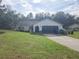 Ranch-style home with attached garage and large yard at 12266 Birch St, Brooksville, FL 34613