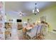 Open concept dining room adjacent to the living room and kitchen at 13600 Crest Lake Dr, Hudson, FL 34669