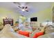 Bright living room featuring comfortable seating and a large TV at 13600 Crest Lake Dr, Hudson, FL 34669