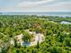 Aerial view showing a park with a curving roadway and water access at 1904 Gulfview Dr, Holiday, FL 34691