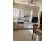 Kitchen with white cabinets, appliances, and a dining area at 2260 Costa Rican Dr # 26, Clearwater, FL 33763