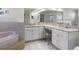 Spacious Primary bathroom with double sinks and a large tub at 2467 Crystal Lake Dr, Spring Hill, FL 34606
