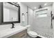 Updated bathroom with a walk-in shower, new vanity, and modern fixtures at 3452 Umber Rd, Holiday, FL 34691