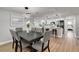 Bright dining room with a dark wood table and gray chairs at 3452 Umber Rd, Holiday, FL 34691