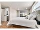Bright bedroom with a queen-size bed and access to a private bathroom at 3452 Umber Rd, Holiday, FL 34691