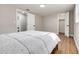 Well-lit bedroom with a full-size bed and access to a nearby bathroom at 3452 Umber Rd, Holiday, FL 34691