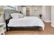 Cozy bedroom with a queen bed, updated flooring, and ample closet space at 3452 Umber Rd, Holiday, FL 34691