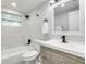 Renovated bathroom with a bathtub, updated vanity, and modern finishes at 3452 Umber Rd, Holiday, FL 34691