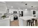 Modern kitchen featuring white cabinets and stainless steel appliances at 3452 Umber Rd, Holiday, FL 34691