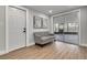 Bright entryway with wood floors, a bench, and sliding glass doors leading to a screened patio at 3452 Umber Rd, Holiday, FL 34691