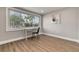 Bright office space with a desk, chair, and large window overlooking the backyard at 3452 Umber Rd, Holiday, FL 34691