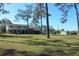 House on a spacious lot with a detached shed and large yard at 8700 Ross Ln, New Port Richey, FL 34654