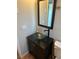 A close-up shot showcases the bathroom's vessel sink and dark vanity at 8700 Ross Ln, New Port Richey, FL 34654