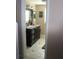 The bathroom features a granite vanity and custom cabinetry at 8700 Ross Ln, New Port Richey, FL 34654