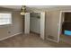 This bedroom offers natural light and a closet at 8700 Ross Ln, New Port Richey, FL 34654