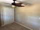 Bedroom featuring a closet and a ceiling fan at 8700 Ross Ln, New Port Richey, FL 34654