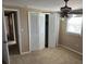 The bedroom boasts ample natural light, fan and closet at 8700 Ross Ln, New Port Richey, FL 34654