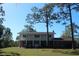 Ranch-style home with a large front yard and mature trees at 8700 Ross Ln, New Port Richey, FL 34654